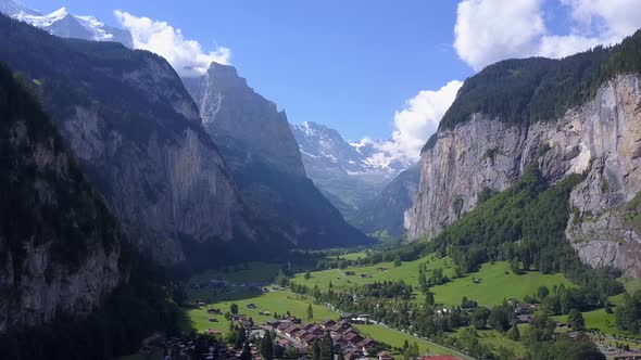 Aerial travel drone view of the Lauterbrunnen Valley and Staubbach Falls, Switzerland. alt