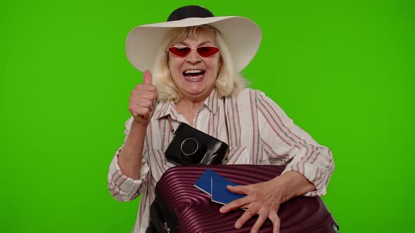 Traveler Tourist Senior Woman Holding Passport Tickets Dreams of Which Country Go Rest on Vacation alt