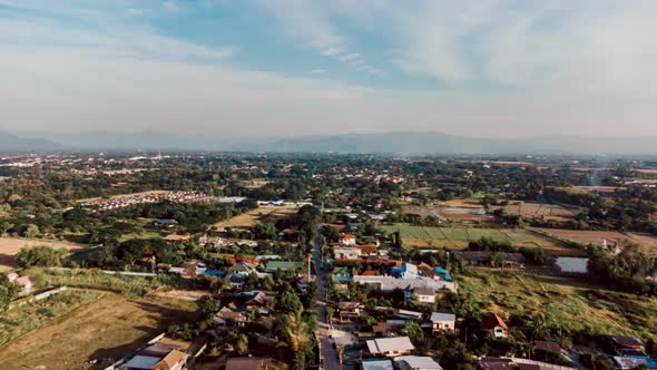 Hyperlapse drone lapse of asian village with blue sky alt