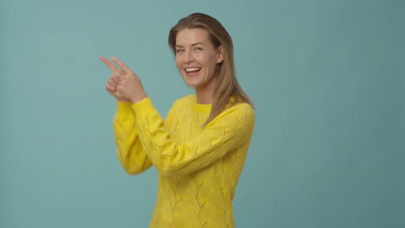 Smiling Woman Pointing in Yellow