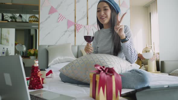 The woman received a Christmas present at home. Excited woman with Christmas Gift alt