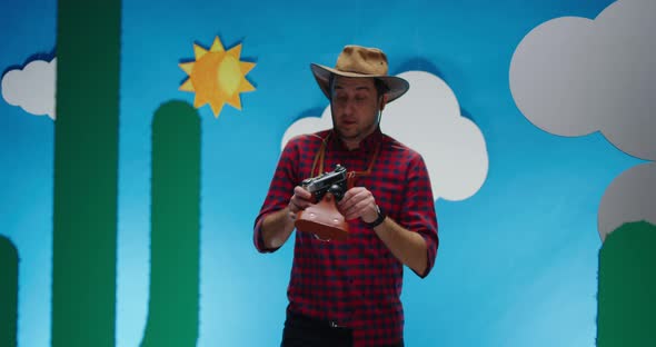 Tourist Walking and Taking Photo in Desert alt