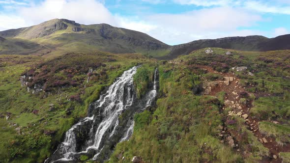 Aerial view of a waterfall in the Isle of Skye in Scotland