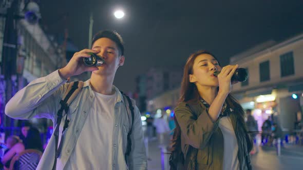 Asian attractive couple drinking alcohol and having party together. alt