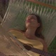 Brunette Girl Has Rest in Hammock and Plays Guitar Singing - VideoHive Item for Sale