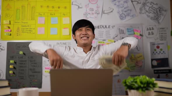 Businessman enjoy with money rain alt