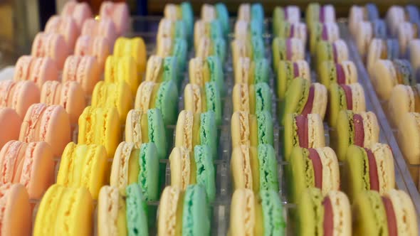Close Up Colorful Macarons Dessert in Bakery Shop at Store Glass Case alt