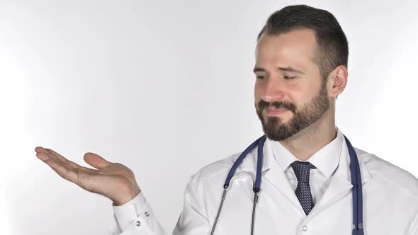 Doctor Showing Product at Side White Background alt