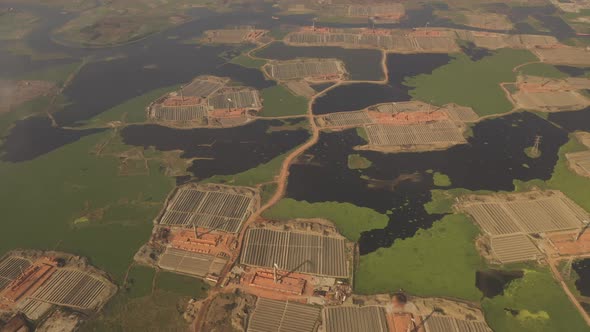 Aerial view of chimneys kilns from brick factory, Dhaka, Bangladesh. alt