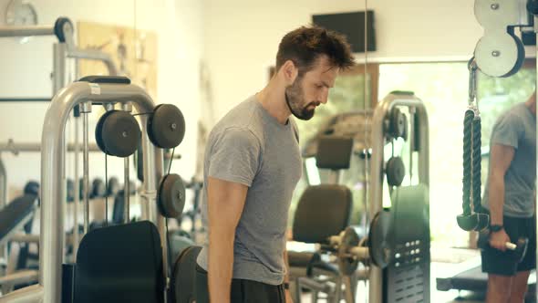 Man Workout Gym.Exercising In Gym.Weight Lifting On Gym Biceps Muscle.Athlete Trains Hard. alt