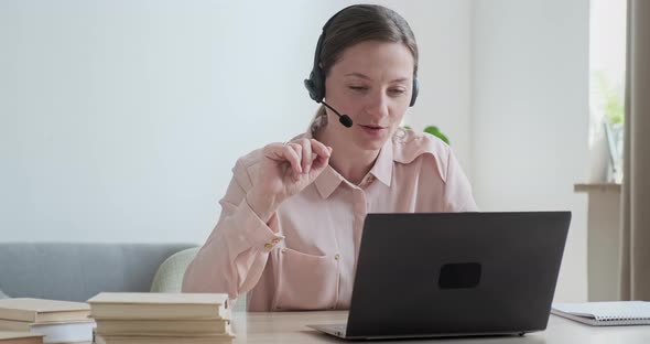 Mother Businesswoman Working Remotely From Home on Video Conference When Cute Boy Rushes Up alt