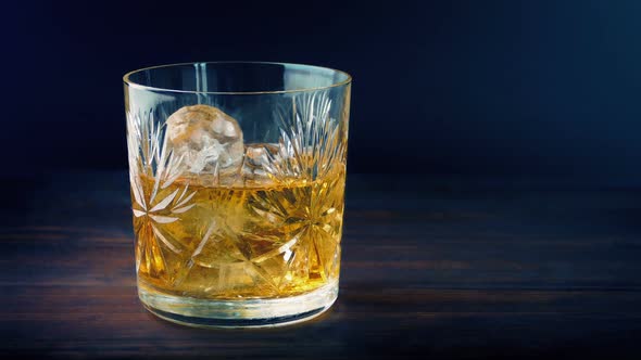 Whiskey Is Poured At Event With Colorful Lights alt