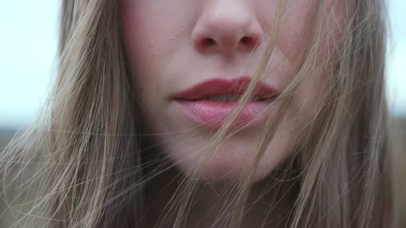 Womans Lips Parting Amid Windswept Hair By Sanneberg VideoHive