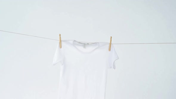 T-shirt drying on clothes line alt