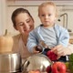 Happy Smiling Mother with Baby Son Playing with Spoons on Pans in Kitchen Like on Drums - VideoHive Item for Sale