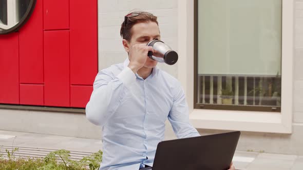 Young and attractive freelancer working outdoor. Office worker or businessperson. alt