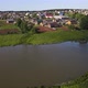 Houses Near River in Small Township on Sunny Day - VideoHive Item for Sale