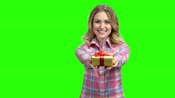 Young Caucasian Woman Offering a Gift alt