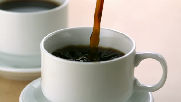 Pouring coffee into cup, Slow Motion alt