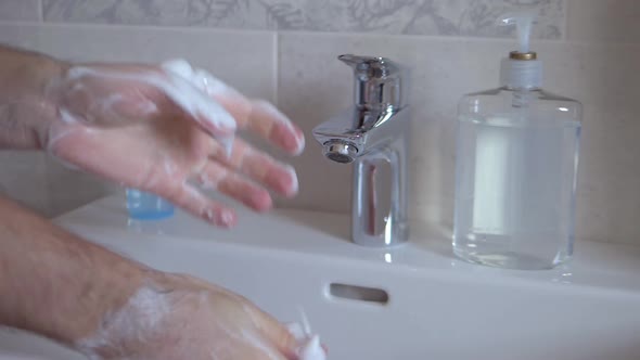 Hands Are Lathered with Soap and Washed Water.