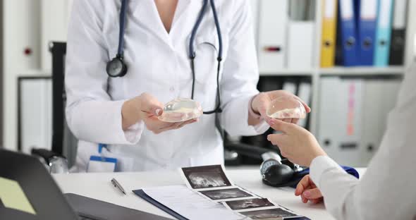 Plastic Cosmetic Surgeon Shows Patient Samples of Breast Implants and Talks About Future Operation alt