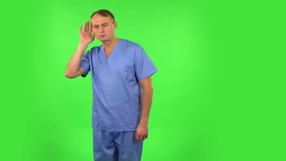 Medical Man Holding Hand Near Ear Trying To Listen Interesting News Expressing Communication Concept alt