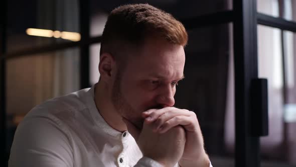 Close-up of Face of Thoughtful Bearded Handsome, Hands Attached To Head. alt