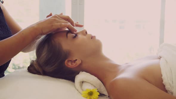 Woman Gets Facial and Head Massage in Luxury Spa alt