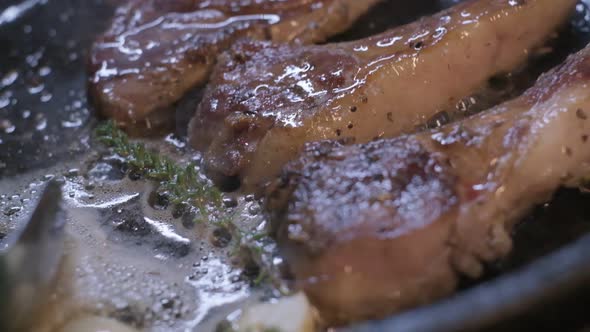 Onions are Thrown to the Сastiron Pan Fried in Butter alt