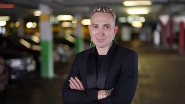Portrait of a Stylish Homosexual Man in the Afternoon in the Parking Lot of a Shopping Center alt