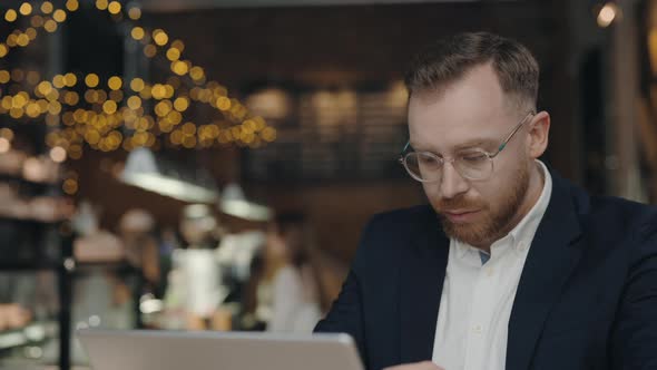 Businessman Sitting at Cafe Feeling Headache During the Work alt