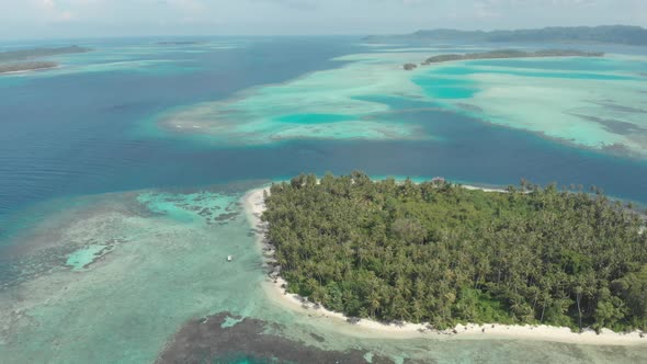 Aerial: flying over desert beach white beach tropical caribbean sea alt