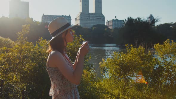 Young photographer taking photo alt