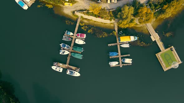 Aerial Top View of Fishing Boats Parked in the Parking Lot for Small Boats alt
