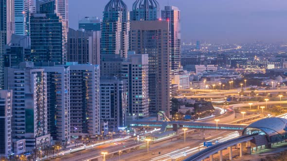 Dubai Marina Skyscrapers Aerial Top View Before Sunrise From JLT in Dubai Night to Day Timelapse UAE alt
