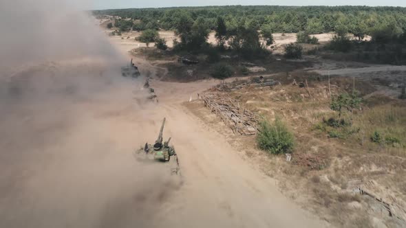 Combat Armored Military Tanks Machinery with Troops Driving on Dusty Sand Battlefield Area alt