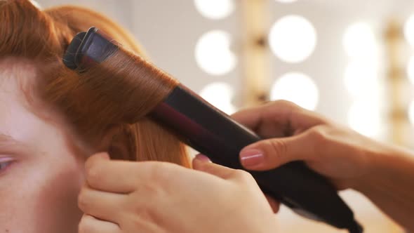 Female Hairdresser Making Haircut to Client in Beauty Salon Slow Motion alt