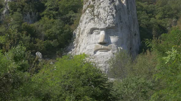 Decebalus  last king of Dacia scalpture 4K 2160p UHD video - Decebalus head  incised in stone near r alt