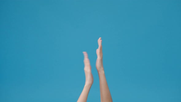 Young woman showing hand clapping applause isolated over blue background in studio. alt