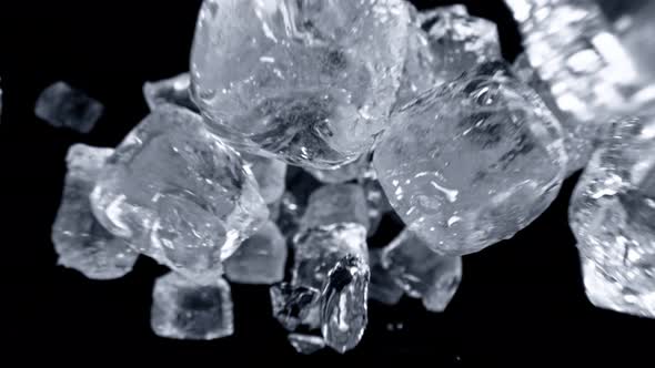 Super Slow Motion Shot of Ice Cubes Flying Towards Camera at 1000Fps alt