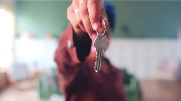 Keys to Apartment or House in Hand Woman Symbolize Renting or Buying Real Estate alt