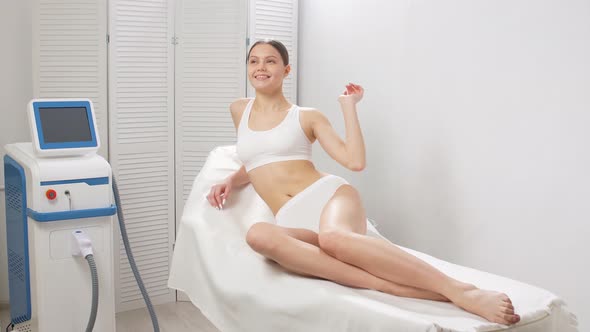 Woman After Laser Epilation and Cosmetology in Beauty Salon. alt