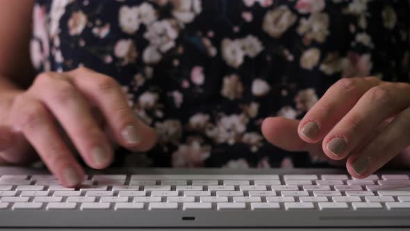 Hands of Woman Typing on Keyboard