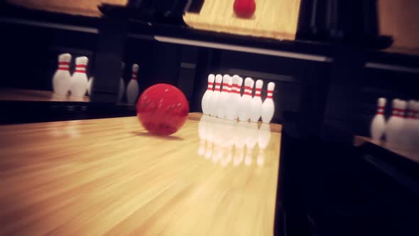 Dynamic animation of striking all the bowling pins. Focused on bowling ball. HD alt