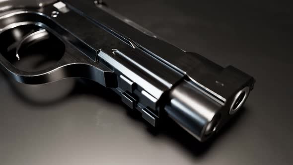 Gun with fingerprints in UV light. Biometric identification in ultraviolet rays alt