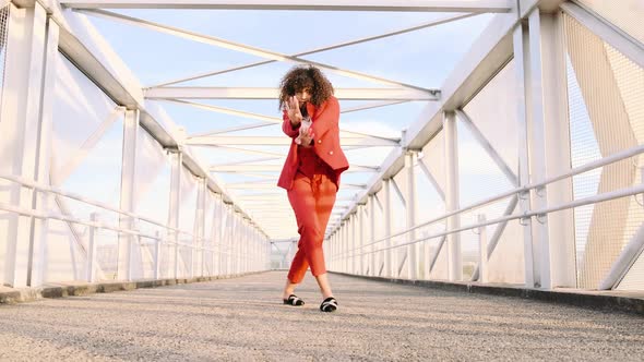 Happy Beautiful Afro-American Woman Walking and Dancing Outdoor