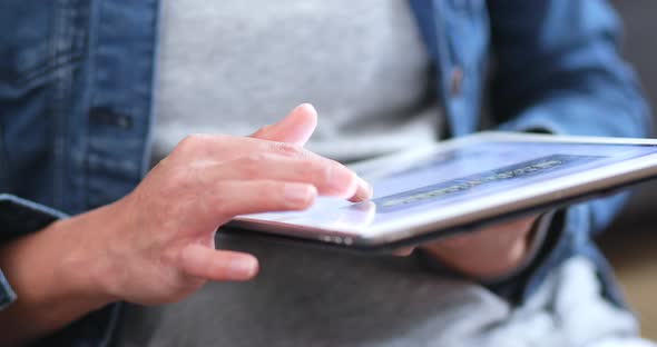 Close up using tablet computer alt