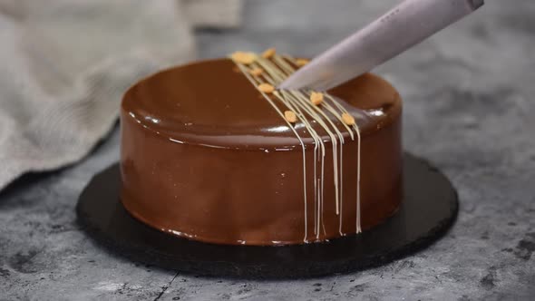 Cutting a Chocolate Caramel Peanut Mousse Cake and Mirror Glaze