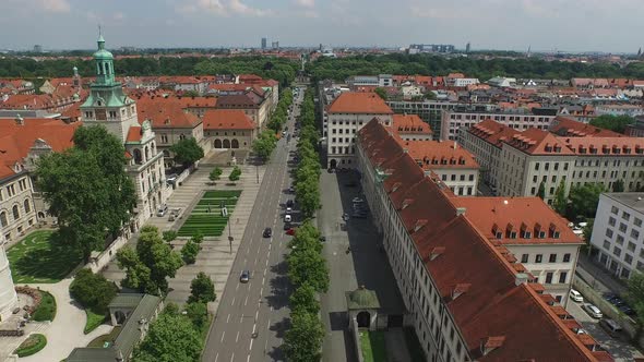 Aerial of buildings and a park along a street