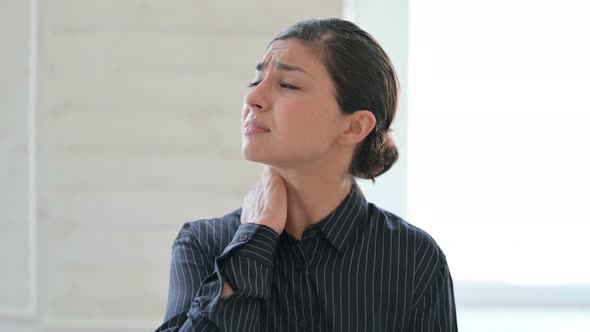 Stressed Young Indian Woman Having Neck Pain  alt
